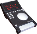 Black electronic remote console device with multiple buttons, a large round control dial, and a red LED display screen.