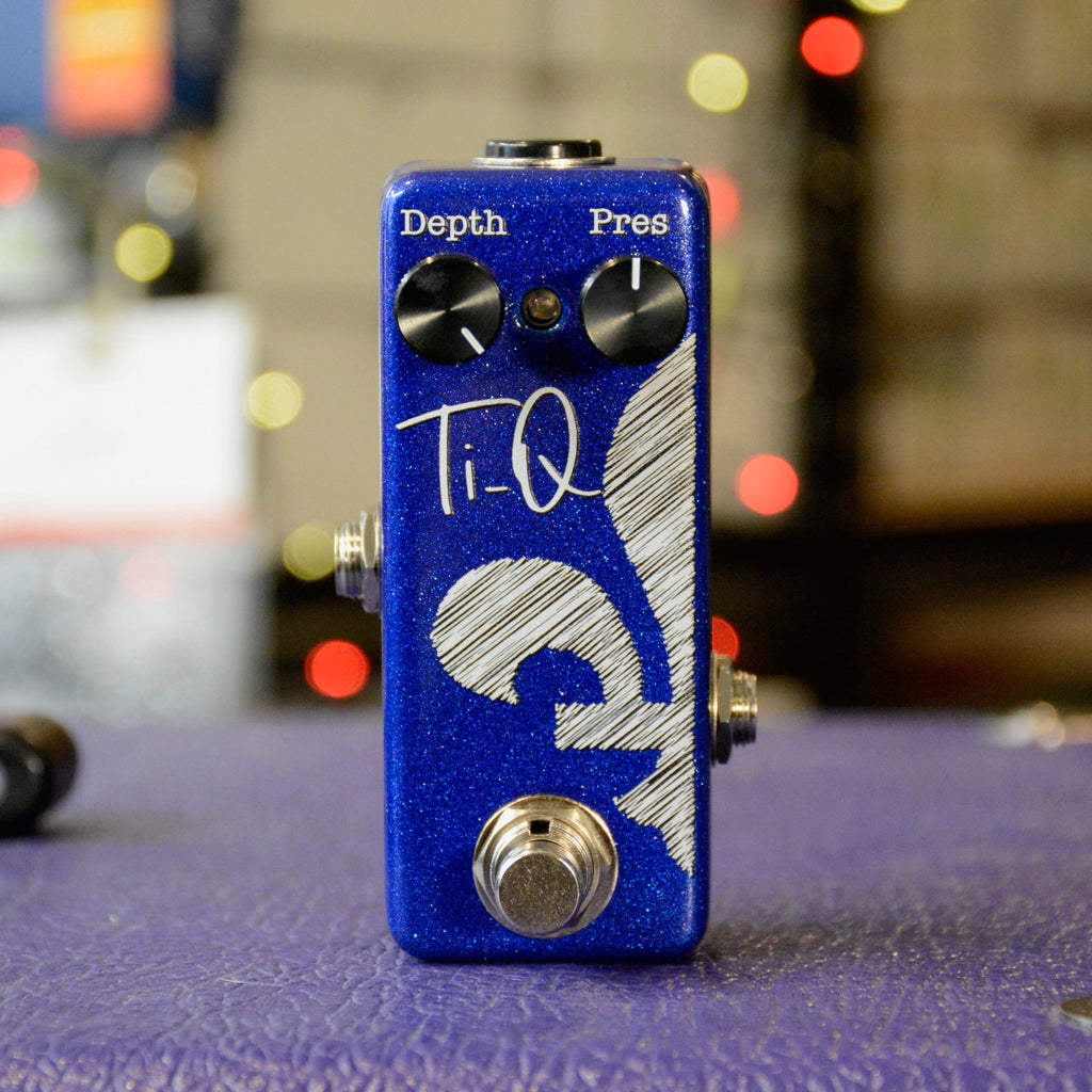 Small blue guitar pedal with two control knobs labeled Depth and Pres and a footswitch.