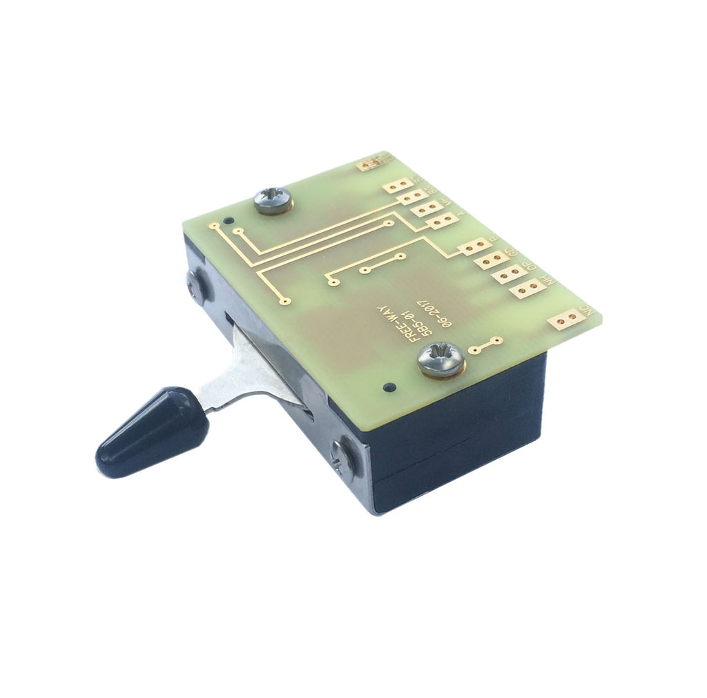 A toggle switch module with a black lever and labeled PCB solder pads for connections.