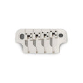 Silver metal bass guitar bridge with four adjustable saddles and two mounting holes on a white background.