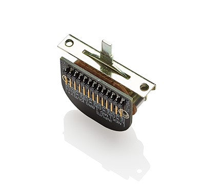 Close-up image of a five-position toggle switch with multi-pin connector and metallic mounting plate.