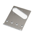 Silver metal guitar bridge plate with four screw holes and a rectangular cutout for pickups.