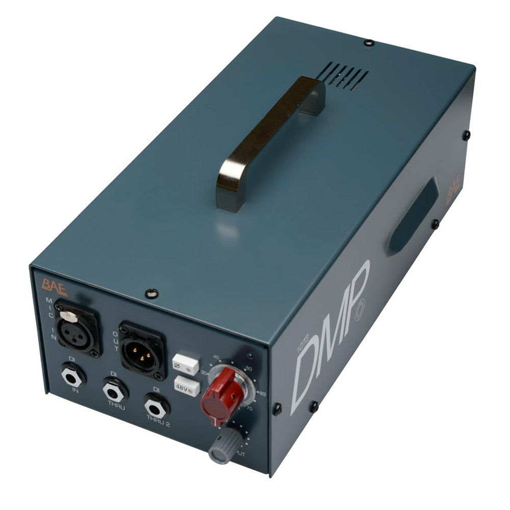 Dark teal rectangular audio device with handle, multiple audio connectors and control knobs on front panel.