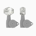 Two silver metal guitar tuning machine heads with gray tuner knobs labeled HIPSHOT.