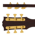 Six gold open gear tuning pegs mounted on a dark brown guitar headstock, arranged in 3+3 configuration.