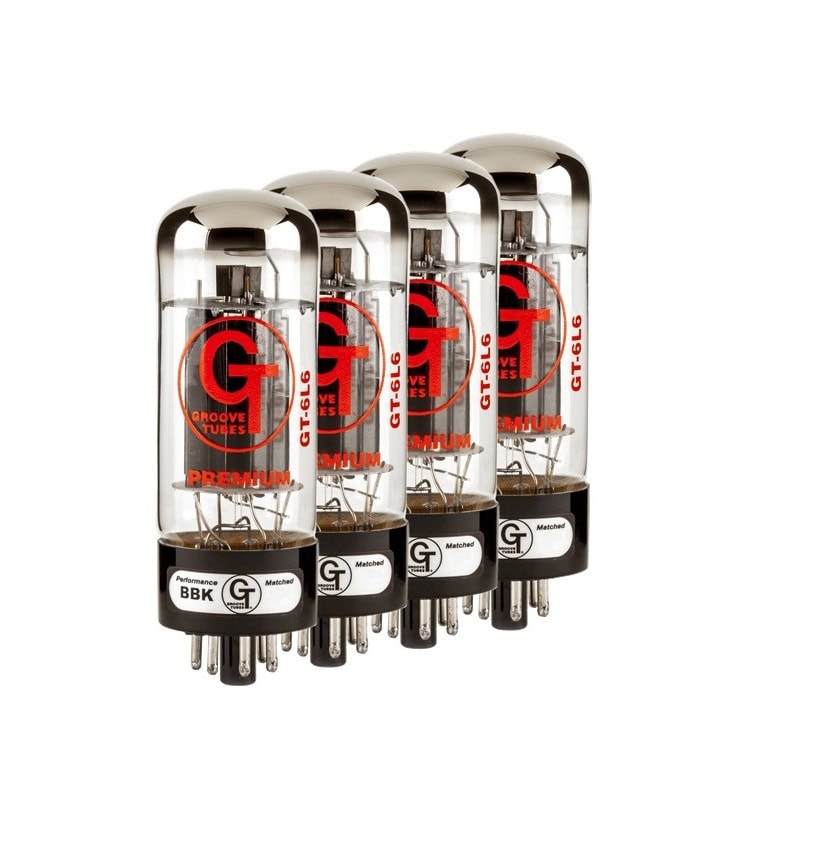 Four glass vacuum tubes with black bases and red and white lettering arranged in a row.