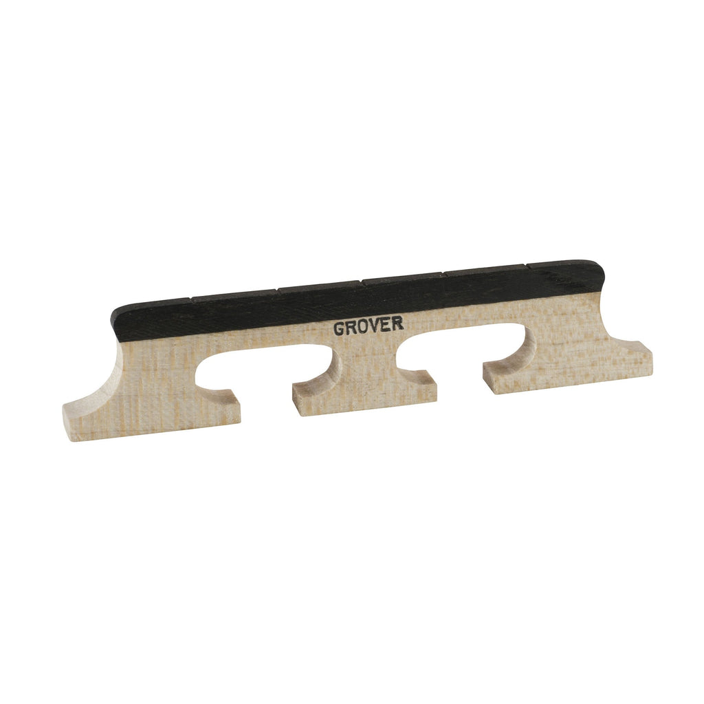 Light-colored wooden banjo bridge piece with black top and grooves, branded Grover.
