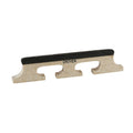 Light-colored wooden banjo bridge piece with black top and grooves, branded Grover.