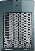 Close-up of a black and gray microphone with a metal grille and SHURE BETA 91A labeling.