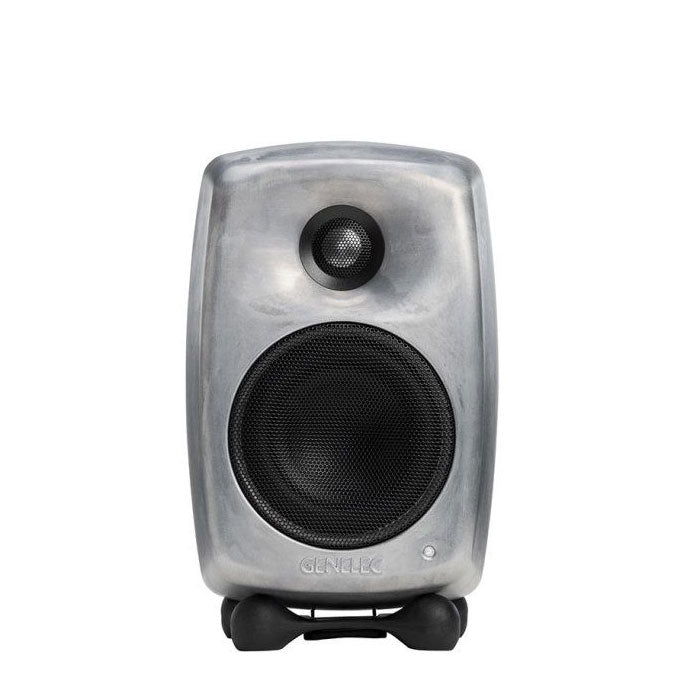 Silver studio monitor speaker with black drivers and isolating stand on white background.