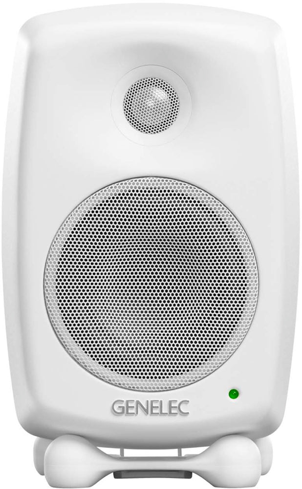 White Genelec branded studio monitor speaker front facing with metal speaker grilles and green indicator light.