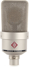 Front view of a silver microphone with metal mesh grille and Neumann logo above text band