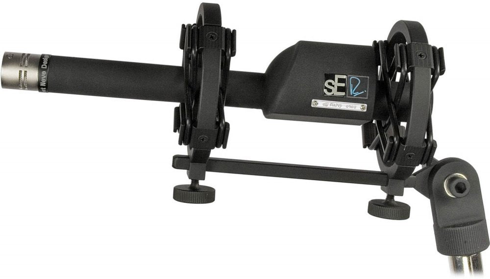 Black shotgun microphone mounted on a shock mount with adjustment knobs and a male 3-pin connector.