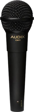 Black handheld microphone with wire mesh grille and gold AUDIX OM11 branding on the handle.