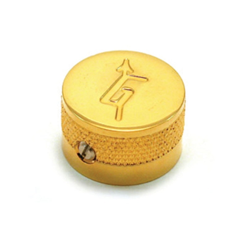 One gold-colored metal knob with textured grip and set screw.
