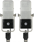 Front view of a pair of black and silver microphones with metal mesh grilles and adjustment screws.