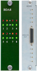 Front and rear views of a green and silver audio converter module with LED indicators and a multi-pin analog output connector.