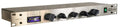 Silver front panel stereo compressor with five black rotary knobs and a green power button.