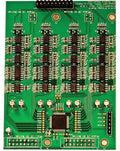 Green printed circuit board with multiple integrated circuits, trimmer potentiometers, and pin headers.