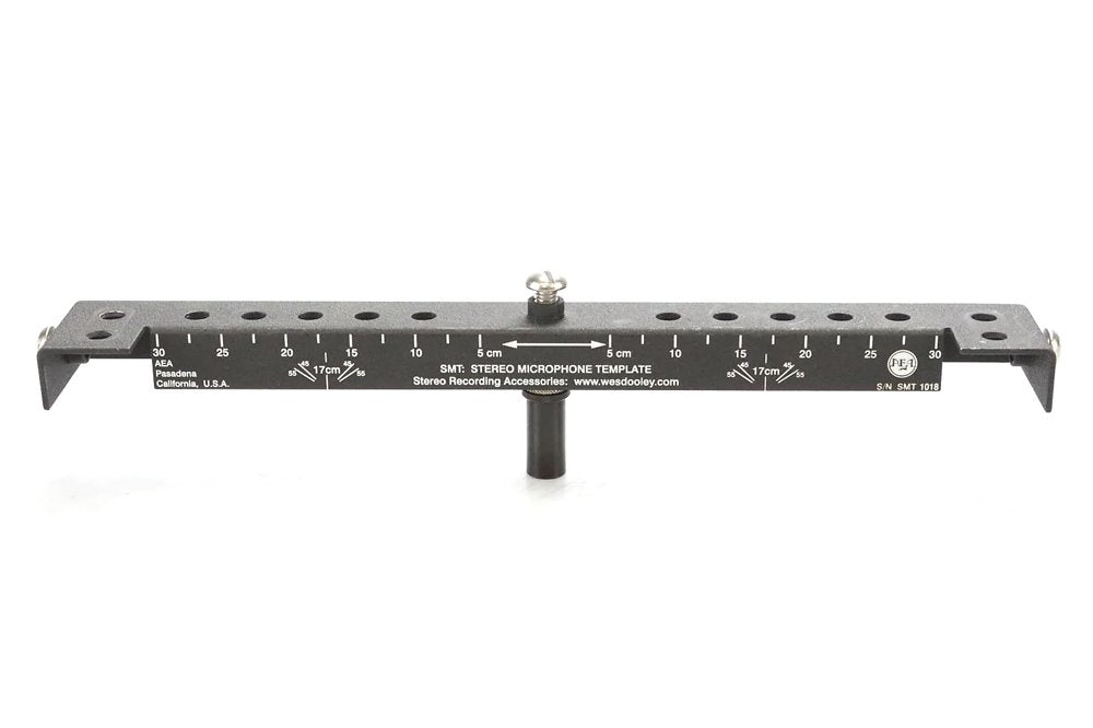 Black metal stereo microphone template bar with measurement markings and adjustment screw.