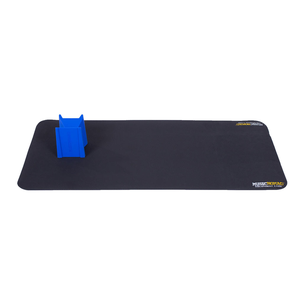 Black rectangular mat with two MusicNomad logos and a blue plastic stand or support piece attached on one end.