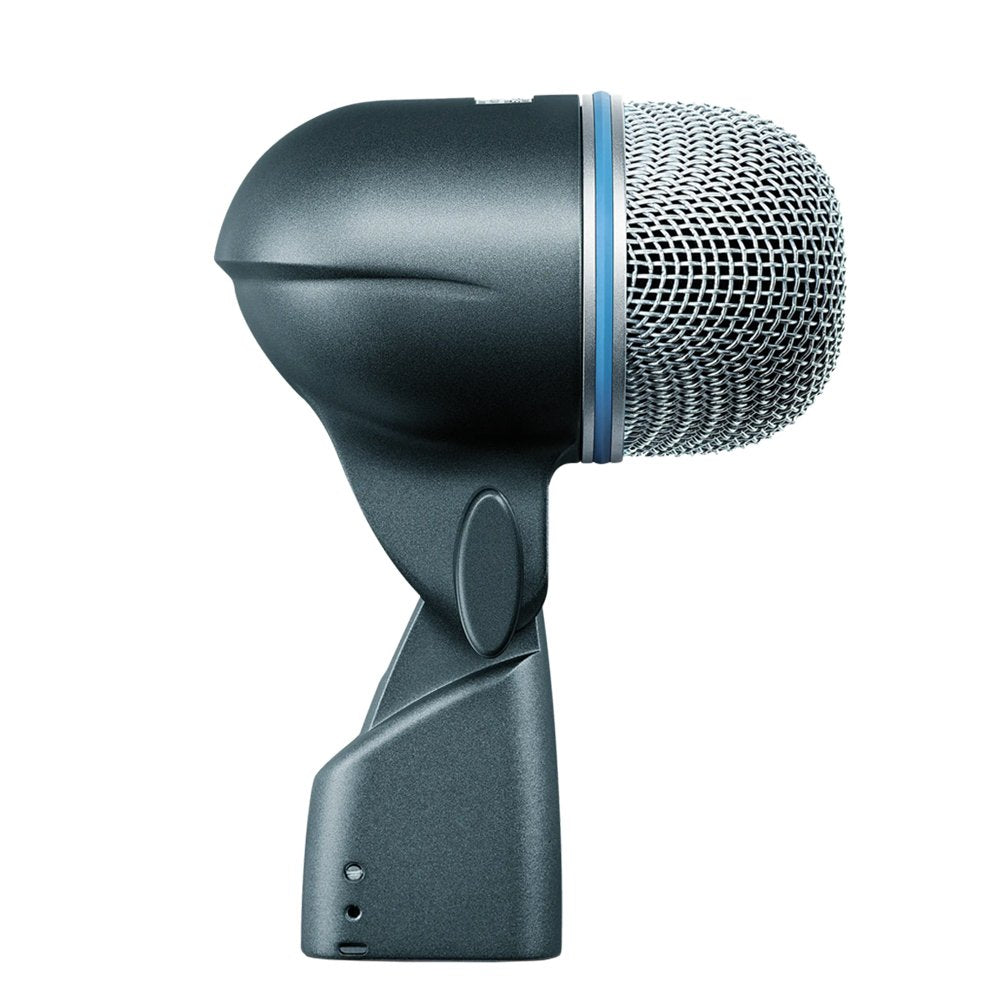 Side view of a large dynamic microphone with a rounded metal grille and blue ring detail.