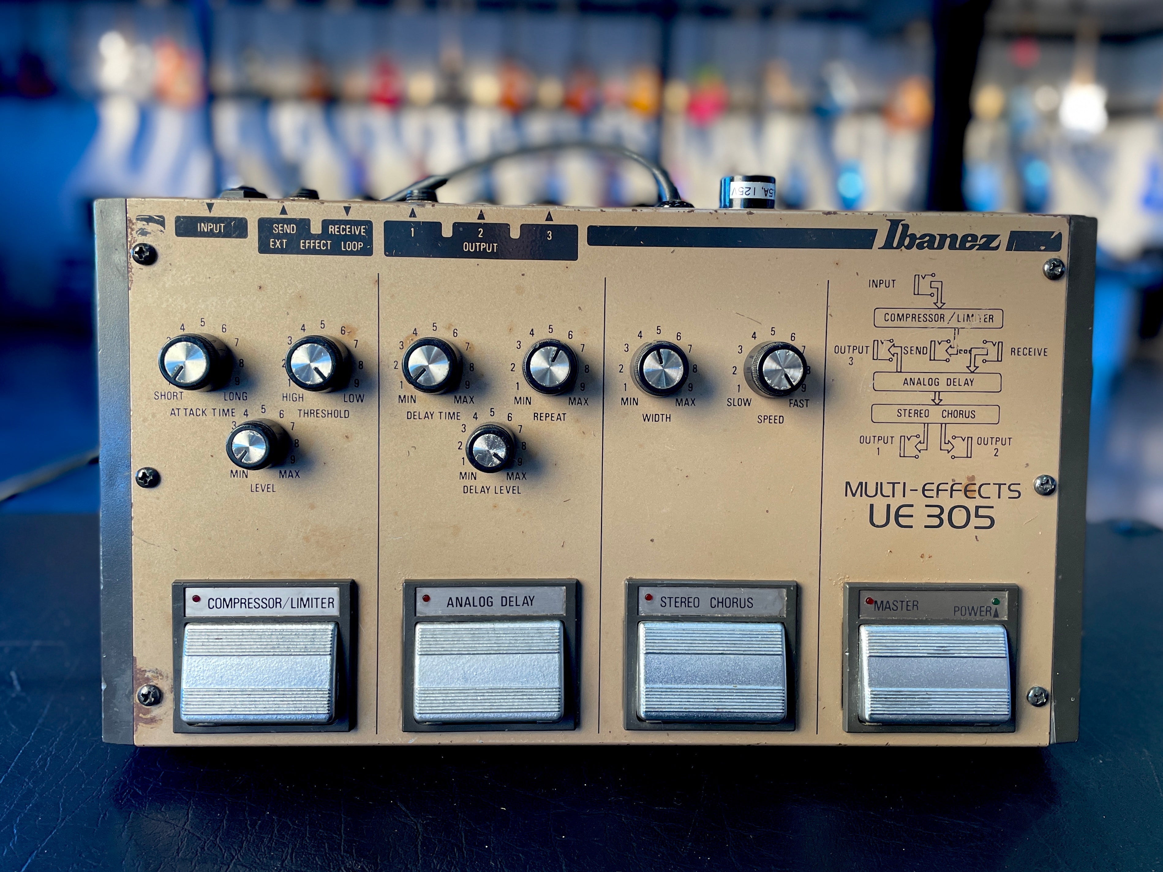 Beige Ibanez UE 305 multi-effects guitar pedal with rotary knobs and footswitches for compressor, delay, and chorus effects.