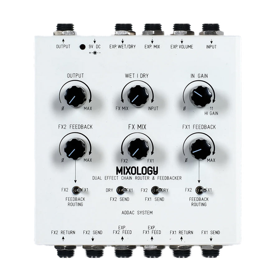White audio effects pedal with six knobs, five toggle switches, and multiple 1/4 inch audio jacks.