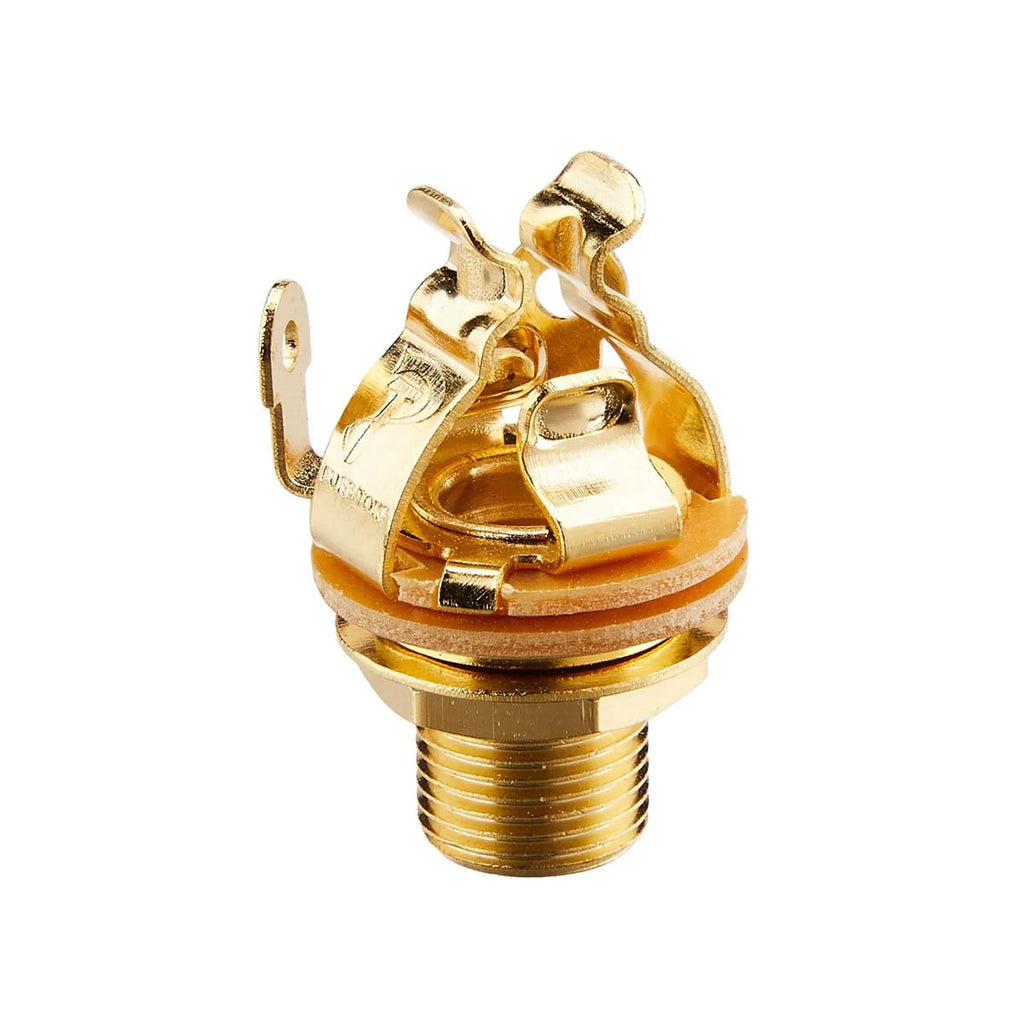 Gold colored 1/4 inch audio jack socket with three metal contact terminals on a beige base.