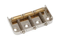Metal guitar bridge with three brass saddles and adjustment springs on a silver base plate