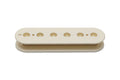 Vintage white plastic bobbin for a guitar pickup with six holes along its length.