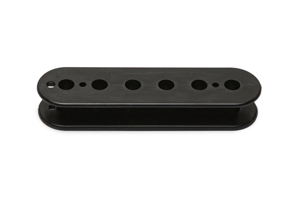 Black plastic pickup bobbin with multiple circular holes, shown on white background.