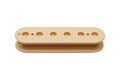Cream-colored plastic pickup bobbin with six holes and two smaller holes on a white background.