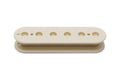 Vintage white pickup bobbin with holes for screws and magnets, shown on a white background.