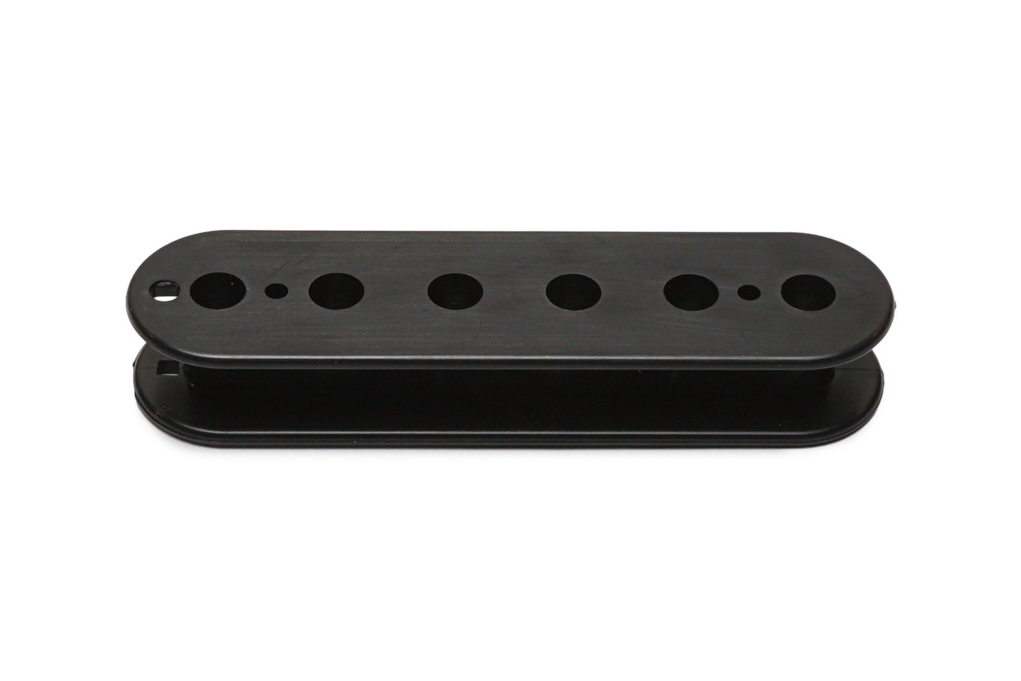 Black elongated plastic pickup bobbin with multiple circular holes arranged in a row.
