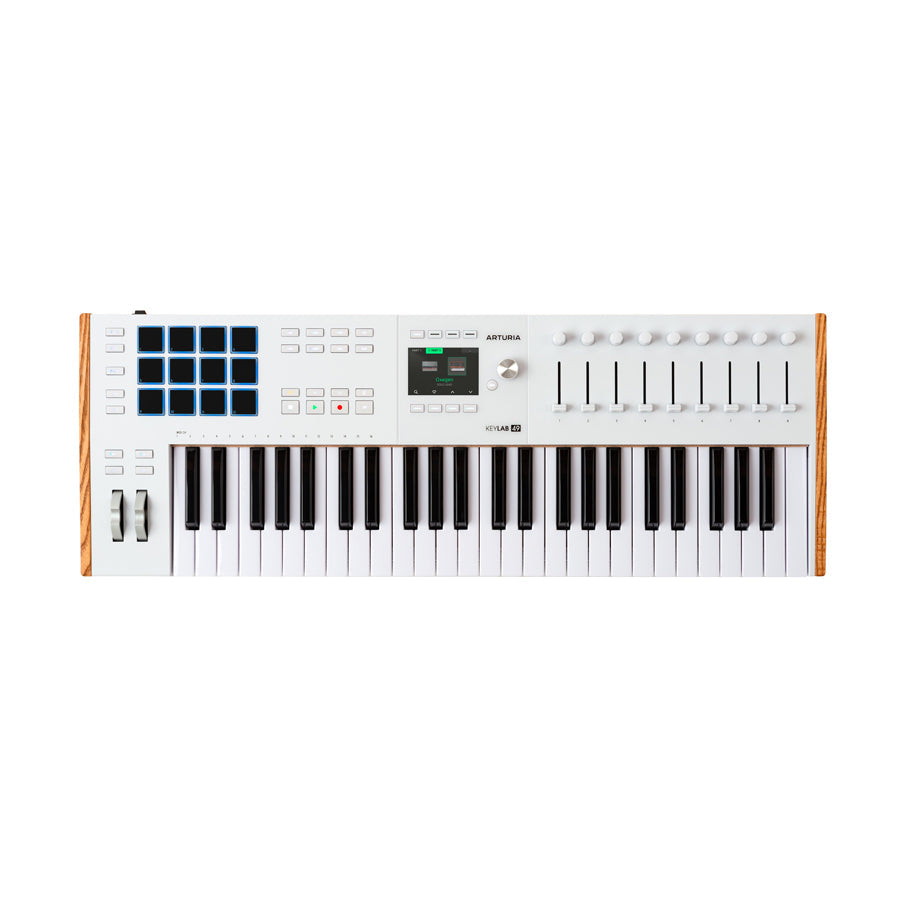 White MIDI keyboard controller with 49 keys, pads, knobs, sliders, and a color display on a white background.