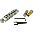 Chrome wraparound guitar bridge with two threaded posts, wrench, and hex key on a white background.
