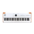 White keyboard synthesizer with wooden ends, pitch bend and modulation wheels, knobs, buttons, and a central circular display.
