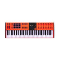 Orange and black 61-key MIDI keyboard controller with pads, faders, knobs, and display screen.