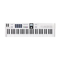 White MIDI keyboard controller with 61 keys, 8 pads, 8 faders, knobs, wheels, and a screen.