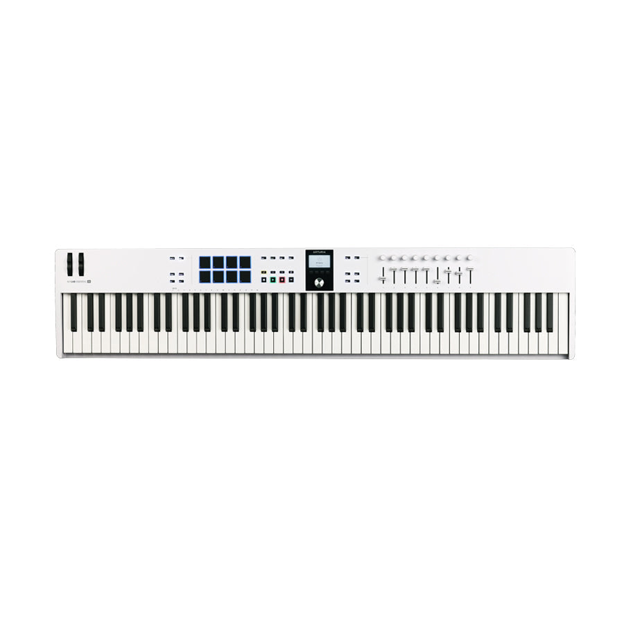 White MIDI keyboard controller with 88 keys, pads, buttons, knobs, faders, display screen, and wheel controllers.