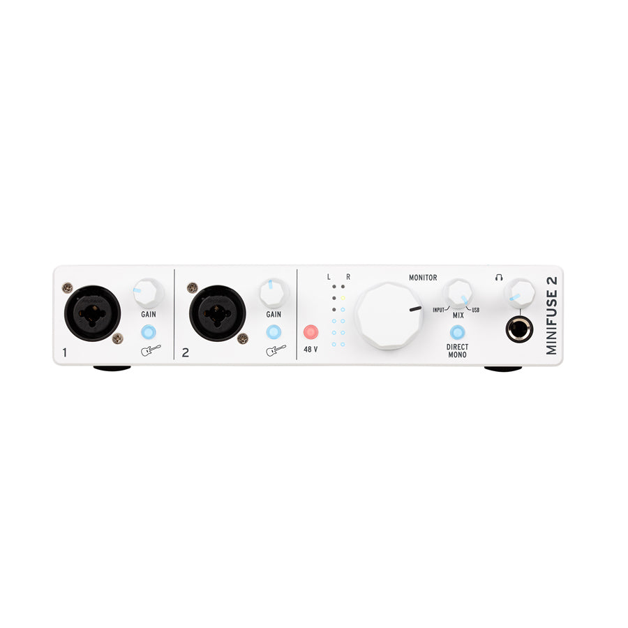 Front view of white audio interface with two combo input jacks, gain controls, monitor volume, and headphone output.