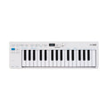 White music keyboard controller with 32 keys, buttons, a small display, and a rotary knob