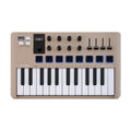 Champagne colored MIDI controller keyboard with 25 keys, knobs, sliders, buttons, and two touch strips.