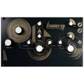 Black synthesizer module with white knobs, gold design, 1/4 inch jacks, and controls labeled for frequency, reverb, delay, and volume.