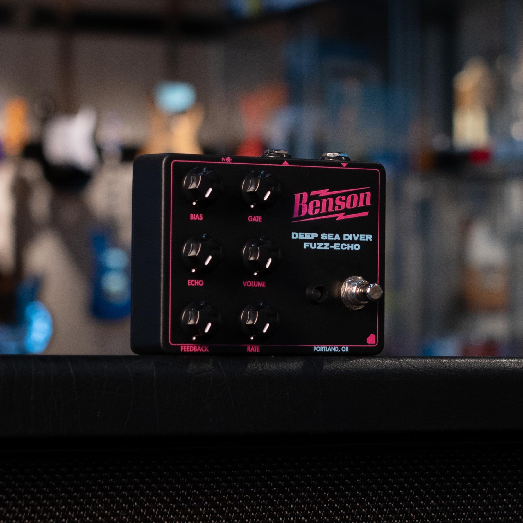 Black Benson Deep Sea Diver Fuzz-Echo pedal with six control knobs and a footswitch on top of a surface.