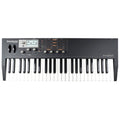 Black keyboard synthesizer with white and black keys, display screen, pitch and modulation wheels, knobs, and buttons.