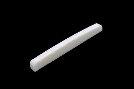 White elongated curved part with slotted notches on a black background.