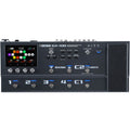 Black multi-effects guitar processor pedal with touchscreen display, multiple footswitches, knobs, and labeled controls.