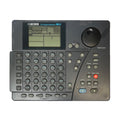 Top view of a Boss Dr. Rhythm Section DR-5 drum machine with numerous buttons, rotary knob, and a display screen.